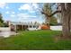 Expansive backyard with lush green grass, mature trees, and plenty of space at 5930 W 34Th Ave, Wheat Ridge, CO 80212