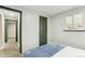 Neutral bedroom with door and window offering natural light at 5930 W 34Th Ave, Wheat Ridge, CO 80212
