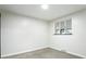 Clean bedroom with a large window, plush carpet, and simple decor at 5930 W 34Th Ave, Wheat Ridge, CO 80212