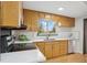 Bright kitchen featuring stainless steel appliances, ample counter space, and a black sink at 5930 W 34Th Ave, Wheat Ridge, CO 80212