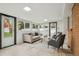 Inviting living room featuring large windows, neutral decor, and modern furnishings at 5930 W 34Th Ave, Wheat Ridge, CO 80212