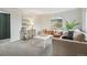 Cozy living space with a white couch and earth tone chairs, ideal for gathering at 5930 W 34Th Ave, Wheat Ridge, CO 80212
