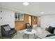Spacious living room with brick details, neutral tones, and ample natural light at 5930 W 34Th Ave, Wheat Ridge, CO 80212