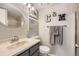 Bathroom with a vanity, updated fixtures, and decorative accents at 2890 W Long Cir # A, Littleton, CO 80120