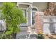 Charming front entrance with brick accent, lush greenery, and a welcoming atmosphere at 2890 W Long Cir # A, Littleton, CO 80120