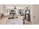 Open-concept kitchen with a breakfast bar and views of the living room at 2890 W Long Cir # A, Littleton, CO 80120