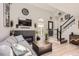Cozy living room featuring a fireplace, hardwood floors, and a staircase at 2890 W Long Cir # A, Littleton, CO 80120