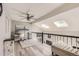 Bright loft area with skylights, fan, and built-in desk creates an ideal home office or study space at 2890 W Long Cir # A, Littleton, CO 80120