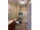 Bathroom with a shower/tub combo with patterned curtain and a single sink vanity at 7140 Simms St # 202, Arvada, CO 80004