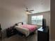 Comfortable bedroom with ample natural light and a ceiling fan at 7140 Simms St # 202, Arvada, CO 80004