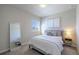 Serene bedroom with neutral tones, a comfortable bed, and ample natural light at 6682 Osage St, Denver, CO 80221