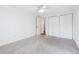 Neutral bedroom offers ample closet space and plenty of natural light at 969 S Pearl St # 103, Denver, CO 80209