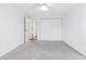 Bright bedroom featuring a ceiling fan, neutral carpet, and closet space at 969 S Pearl St # 103, Denver, CO 80209