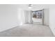Bright bedroom with large window and soft carpet at 969 S Pearl St # 103, Denver, CO 80209