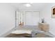 Bright bedroom featuring a ceiling fan, neutral carpet, and closet space at 969 S Pearl St # 103, Denver, CO 80209