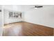 Empty room with hardwood floors, natural light, and neutral walls at 969 S Pearl St # 103, Denver, CO 80209