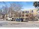 Apartment building exterior shows architectural details, with cars parked on the street at 969 S Pearl St # 103, Denver, CO 80209