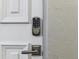 A close-up of a Yale digital lock on a front door at 969 S Pearl St # 103, Denver, CO 80209