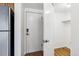 Hallway with wood flooring and a door leading to a closet or storage space at 969 S Pearl St # 103, Denver, CO 80209