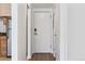 Hallway with wood flooring and a door leading to the exterior at 969 S Pearl St # 103, Denver, CO 80209