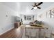 Living room with hardwood floors, natural light, comfortable seating, and dining area at 969 S Pearl St # 103, Denver, CO 80209