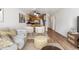 Cozy living space with open floor plan and an adjacent dining area and kitchen at 969 S Pearl St # 103, Denver, CO 80209