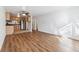 Spacious living area showcasing the wood flooring and open layout to the kitchen at 969 S Pearl St # 103, Denver, CO 80209