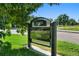 Classic Denver Washington Park entrance sign, surrounded by lush green grass and trees at 969 S Pearl St # 103, Denver, CO 80209