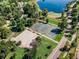 Aerial view of well-maintained basketball and tennis courts amidst lush greenery and walking paths at 969 S Pearl St # 103, Denver, CO 80209