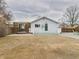 Backyard with a white house, green door, patio, wooden structure, and wooden fence at 3150 S Pennsylvania Street, Englewood, CO 80113
