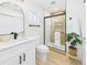 Bright bathroom with a glass-enclosed shower, sleek fixtures, and a modern vanity at 3150 S Pennsylvania Street, Englewood, CO 80113