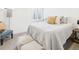 Cozy bedroom featuring neutral tones, soft textures, and ample natural light at 3150 S Pennsylvania Street, Englewood, CO 80113