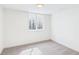 Simple bedroom with neutral carpeting and white walls at 3150 S Pennsylvania Street, Englewood, CO 80113