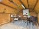 The interior of the home office shed includes a desk, table, chairs, shelving, rug, and lighting at 3150 S Pennsylvania Street, Englewood, CO 80113