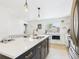 Spacious kitchen featuring modern island, updated appliances, and ample counter space for cooking at 3150 S Pennsylvania Street, Englewood, CO 80113