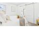 Serene bedroom with neutral tones, a sliding barn door to the bathroom, and a cozy feel at 3150 S Pennsylvania Street, Englewood, CO 80113