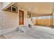 Backyard with patio, wooden fence, and storage shed at 1017 Florence St, Aurora, CO 80010