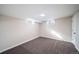 Unfinished basement with neutral walls and carpeted floor at 1017 Florence St, Aurora, CO 80010