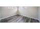 Simple bedroom with grey laminate flooring and neutral walls at 1017 Florence St, Aurora, CO 80010