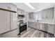 Updated kitchen featuring gray shaker cabinets and quartz countertops at 1017 Florence St, Aurora, CO 80010
