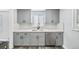 Modern kitchen with gray cabinets, quartz countertops and a window at 1017 Florence St, Aurora, CO 80010