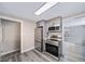 Modern kitchen with stainless steel appliances and gray cabinets at 1017 Florence St, Aurora, CO 80010