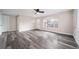 Spacious living room with gray vinyl plank flooring and ceiling fan at 1017 Florence St, Aurora, CO 80010