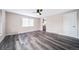 Spacious living room with gray vinyl plank flooring and ceiling fan at 1017 Florence St, Aurora, CO 80010
