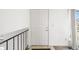 Clean, bright foyer featuring a classic white front door and modern railing at 814 Glenwood Dr, Lafayette, CO 80026