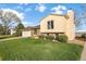 Charming home with a green lawn and tidy landscaping featuring brick accents and neutral siding at 814 Glenwood Dr, Lafayette, CO 80026