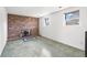 Cozy living room with a brick fireplace and large windows for natural light at 814 Glenwood Dr, Lafayette, CO 80026