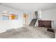 Open living room featuring an adjacent kitchen and a staircase at 814 Glenwood Dr, Lafayette, CO 80026
