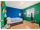 Vibrant bedroom featuring hardwood floors, bright walls, and a cozy atmosphere at 4814 Monarch Dr, Firestone, CO 80504