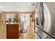 Bright eat-in kitchen with granite countertops, stainless steel appliances, and a sliding glass door at 4814 Monarch Dr, Firestone, CO 80504